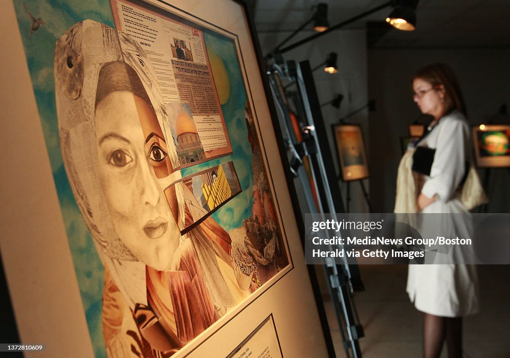 (022510 Cambridge, MA) Fuensanta Eulacio whose daughter Veronica has Gaucher Disease looks at the "Expression of Hope" exhibit, featuring "Untitled," left, by Jusine Crosby of the US who has Pompe Disease along with collaborator Fida Husein of Isra