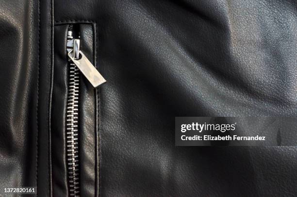 leather jacket, close-up of zipper - black leather texture stock-fotos und bilder