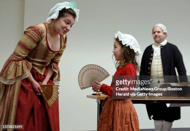 First Lady Abigail Adams, portrayed by Roberta DeCenzo, explains fashions of her time to Christina Quin of Sudbury, as President John Adams,...
