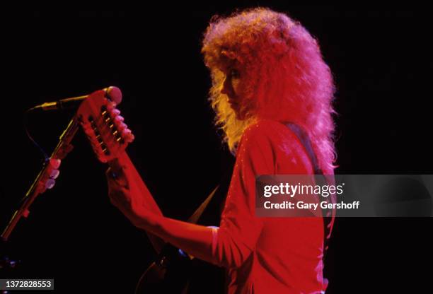 American Rock musician Nancy Wilson, of the group Heart, plays guitar as she performs onstage at Radio City Music Hall, New York, New York, July 17,...