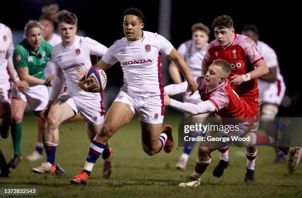 Cassius Cleaves of England evades the challenge from Cameron Winnett of Wales during the Under-20 Six Nations match between England U20 and Wales U20...