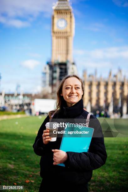 happy female student in london - study abroad stock pictures, royalty-free photos & images