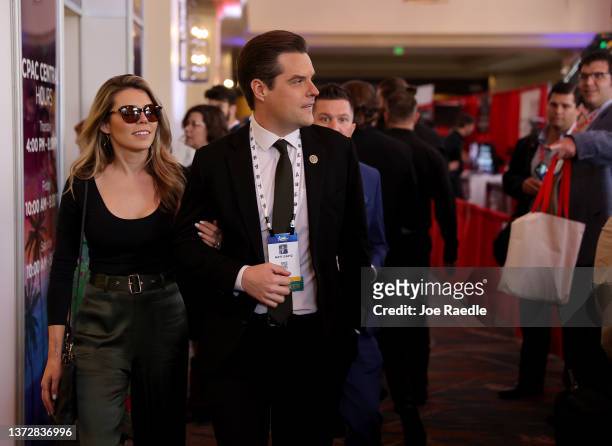 Rep. Matt Gaetz walks with his wife, Ginger Luckey, as they attend the Conservative Political Action Conference at The Rosen Shingle Creek on...