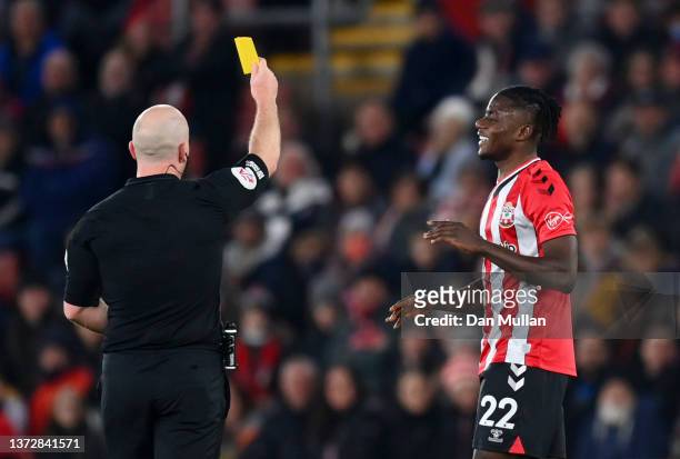 Mohammed Salisu of Southampton is shown a yellow card by referee Simon Hooper during the Premier League match between Southampton and Norwich City at...