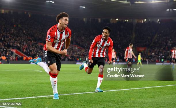 Che Adams of Southampton celebrates with Kyle Walker-Peters after opening the scoring during the Premier League match between Southampton and Norwich...