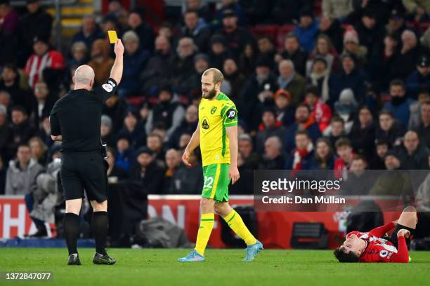 Teemu Pukki of Norwich City is shown a yellow card by referee Simon Hooper following a foul on Valentino Livramento of Southampton during the Premier...