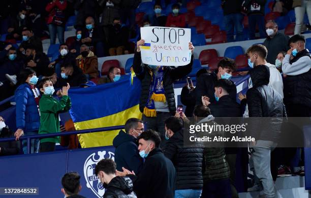 Fans Ukrainian Levante protest against war in Ukraine during the LaLiga Santander match between Levante UD and Elche CF at Ciutat de Valencia Stadium...