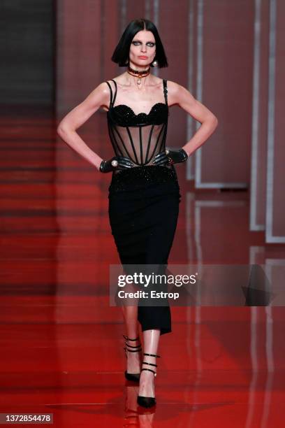 Model walks the runway at the Versace fashion show during the Milan Fashion Week Fall/Winter 2022/2023 on February 25, 2022 in Milan, Italy.