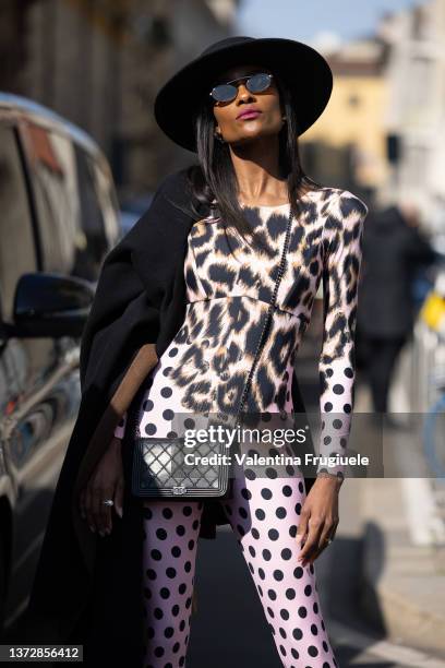 Guest is seen ahead of the Etro fashion show wearing a leopard polka dot onsie during the Milan Fashion Week Fall/Winter 2022/2023 on February 25,...