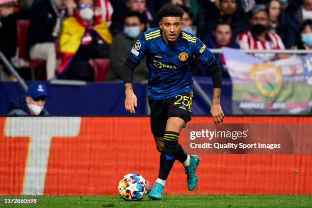 Sancho of Manchester United runs with the ball during the UEFA Champions League Round Of Sixteen Leg One match between Atletico Madrid and Manchester...