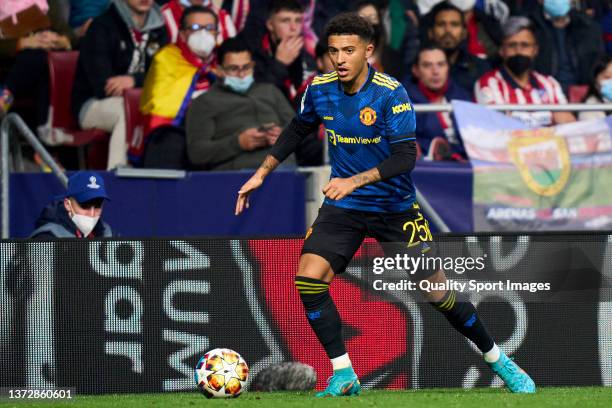 Sancho of Manchester United runs with the ball during the UEFA Champions League Round Of Sixteen Leg One match between Atletico Madrid and Manchester...