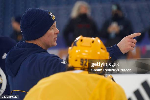 Head coach John Hynes of the Nashville Predators coaches during a practice session prior to the 2022 Navy Federal Credit Union NHL Stadium Series at...