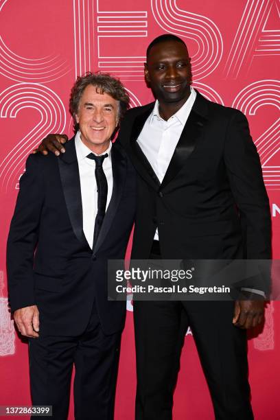 Francois Cluzet and Omar Sy pose during the 47th Cesar Film Awards Ceremony At L'Olympia on February 25, 2022 in Paris, France.