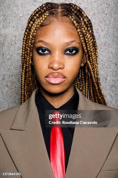 Model Jadore Benjamin poses backstage of the Sportmax fashion show during the Milan Fashion Week Fall/Winter 2022/2023 on February 25, 2022 in Milan,...