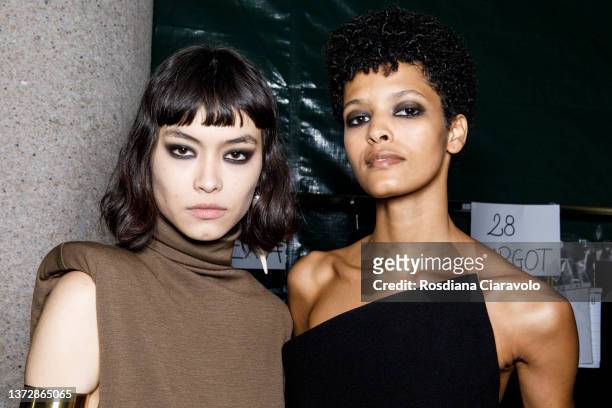 Maryel Uchida and Laiza De Moura pose backstage of the Sportmax fashion show during the Milan Fashion Week Fall/Winter 2022/2023 on February 25, 2022...