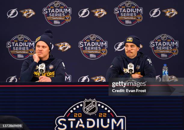 Mikael Granlund and Juuse Saros of the Nashville Predators attend a press conference after practice at Nissan Stadium on February 25, 2022 in...