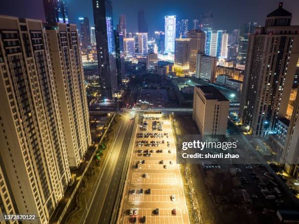 overlooking the parking lot at night - liaoning province stock pictures, royalty-free photos & images