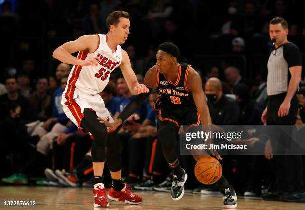 Barrett of the New York Knicks dribbles the ball during the first quarter against Duncan Robinson of the Miami Heat at Madison Square Garden on...