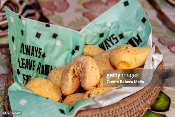 cheese breads in the basket ready to eat. - pão de queijo stock pictures, royalty-free photos & images
