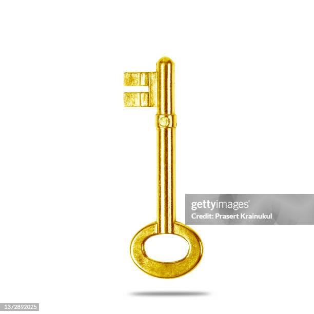 old gold key  isolated on white - golden key stock-fotos und bilder