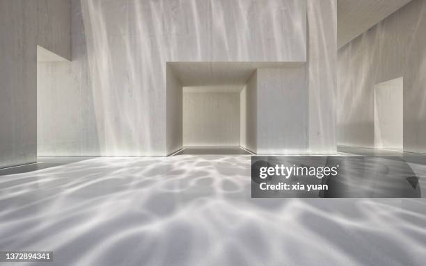 empty hall in a modern building with underwater ripple pattern - light architecture foto e immagini stock