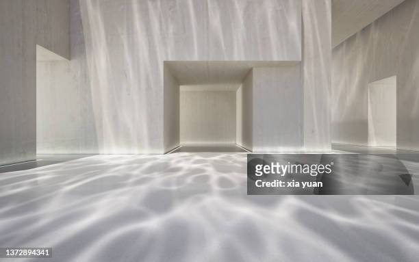 empty hall in a modern building with underwater ripple pattern - interior architecture stock pictures, royalty-free photos & images