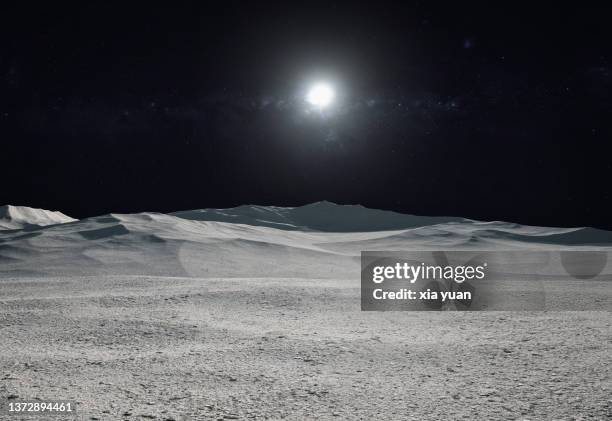 moon surface with distant sun and starfield - sonne und mond stock-fotos und bilder