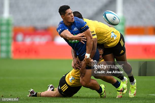 Roger Tuivasa-Scheck of the Blues offloads the ball during the round two Super Rugby Pacific match between the Blues and the Hurricanes at Forsyth...