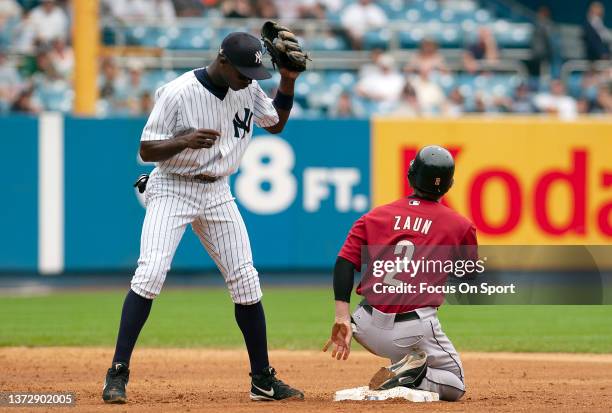 Alfonso Soriano of the New York Yankees puts the tag on Gregg Zaun of the Houston Astros during an Major League Baseball game JUNE 12, 2003 at Yankee...