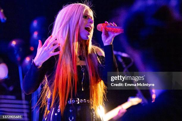 Avril Lavigne performs onstage at 'Avril Lavigne performs live at the Roxy for SiriusXM and Pandora's Small Stage Series' on February 25, 2022 in...