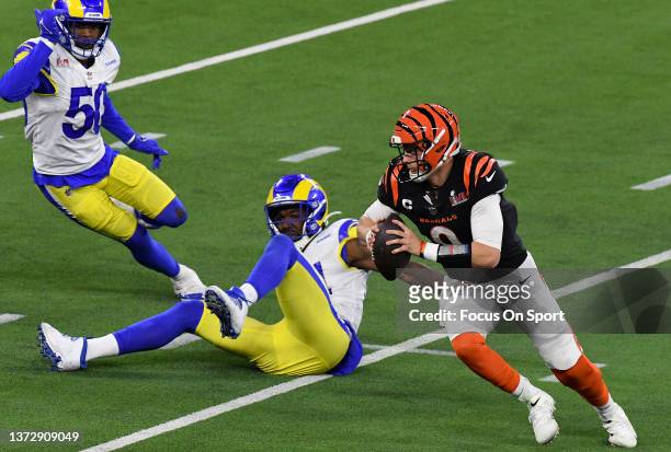 Joe Burrow of the Cincinnati Bengals scrambles with the ball against the Los Angeles Rams during Super Bowl LVI at SoFi Stadium on February 13, 2022...