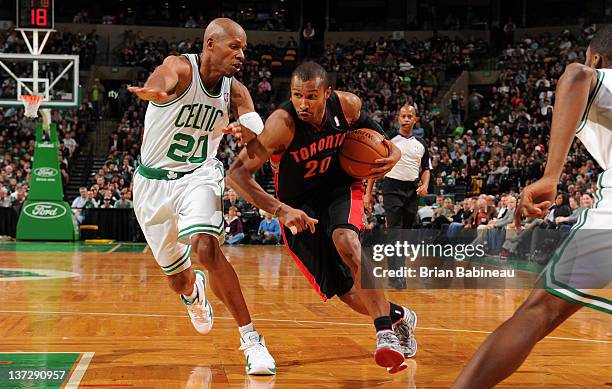 Leandro Barbosa of the Toronto Raptors drives to the basket against Ray Allen of the Boston Celtics on January 18, 2012 at the TD Garden in Boston,...