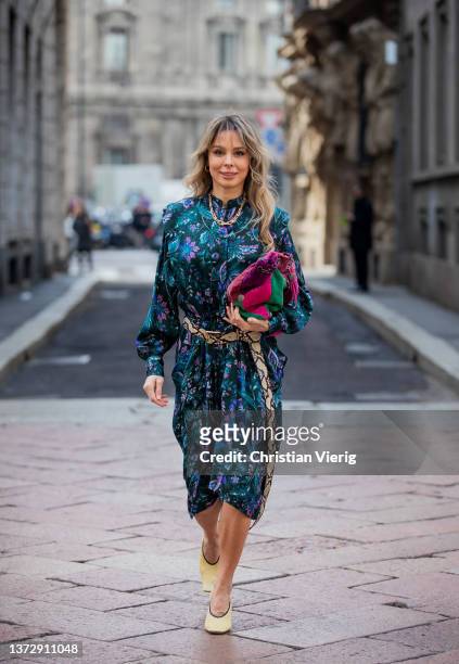 Ekaterina Mamaeva is seen wearing dress with floral print Isabel Marant Etoile, Alexander McQueen belt with snake print, beige heels Bottega Veneta,...