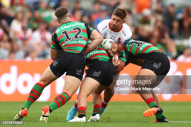 Zac Lomax of the Dragons is tackled during the Charity Shield NRL Trial Match between the South Sydney Rabbitohs and St George Illawarra Dragons at...