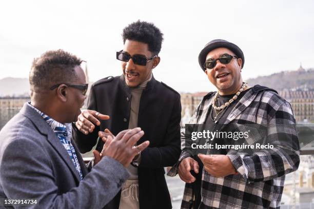 black ethnic man, real people. tourist in stylish clothes and sunglasses having fun in the city - black suit sunglasses stock pictures, royalty-free photos & images