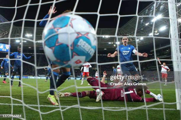 Benjamin Huebner of Hoffenheim scores a goal past goalkeeper Florian Mueller of Stuttgart which was later disallowed for offside by the VAR during...