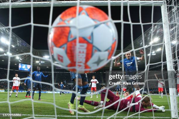 Benjamin Huebner of Hoffenheim scores a goal past goalkeeper Florian Mueller of Stuttgart which was later disallowed for offside by the VAR during...