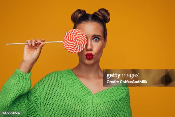 beautiful woman with big lollipop - fashion food stock pictures, royalty-free photos & images