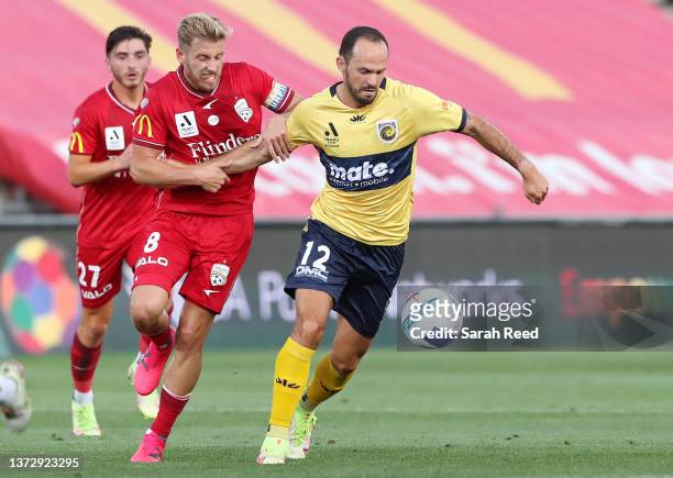 Stefan Mark of United and Marco Urena of the Mariners during the A-League men's match between Adelaide United and Central Coast Mariners at Coopers...
