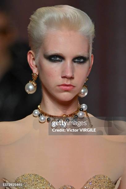 Model walks the runway during the Versace Ready to Wear Fall/Winter 2022-2023 fashion show as part of the Milan Fashion Week on February 25, 2022 in...