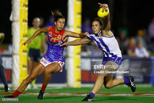 Jasmine Garner of the Kangaroos and Libby Birch of the Demons contest the ball during the round eight AFLW match between the Melbourne Demons and the...