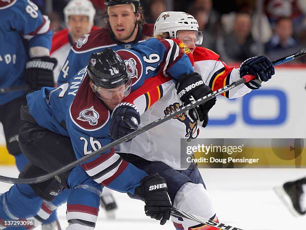 Paul Stastny of the Colorado Avalanche and Kris Versteeg of the Florida Panthers battle for position at the Pepsi Center on January 18, 2012 in...
