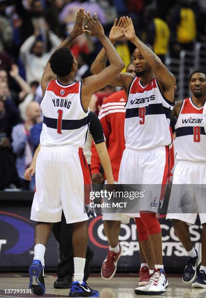 Washington Wizards shooting guard Nick Young and Washington Wizards small forward Rashard Lewis celebrate following a 105-102 victory over the...