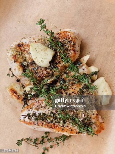 turkey fillet baked with garlic and thyme - chicken roasting oven stock pictures, royalty-free photos & images