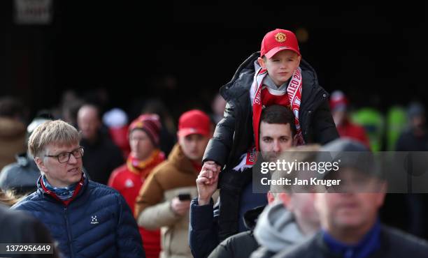 Manchester United fans arrive at the stadium prior to the Premier League match between Manchester United and Watford at Old Trafford on February 26,...