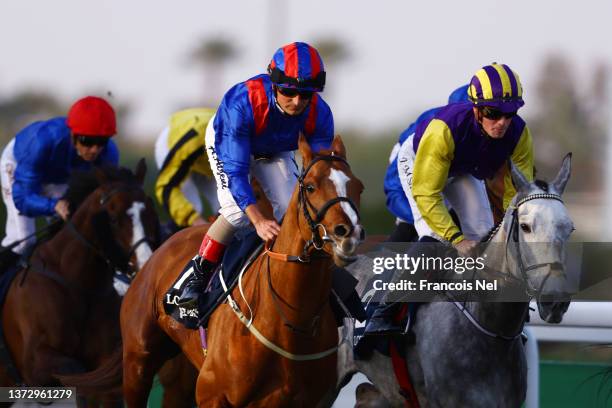 Andrea Atzeni riding Nayef Road and Joey Sheridan riding Princess Zoe in The Longines Red Sea Turf Handicaprace during The Saudi Cup 2022 at King...