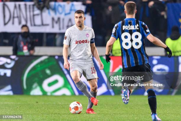 Sokratis Papastathopoulos of Olympiacos controls the ball during the UEFA Europa League Knockout Round Play-Offs Leg One match between Atalanta and...