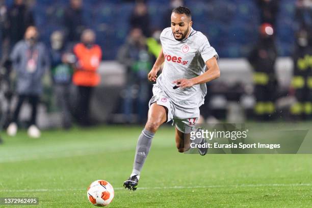 Youssef El-Arabi of Olympiacos runs with the ball during the UEFA Europa League Knockout Round Play-Offs Leg One match between Atalanta and...