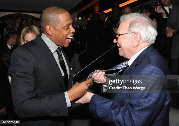 Jay-Z and Warren Buffett attend the grand re-opening of Jay-Z's 40/40 Club on January 18, 2012 in New York City.