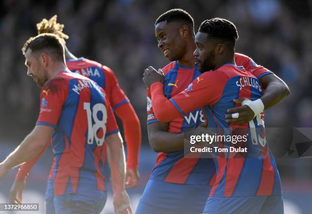 Jeffrey Schlupp of Crystal Palace celebrates with Marc Guehi after scoring their side's first goal during the Premier League match between Crystal...